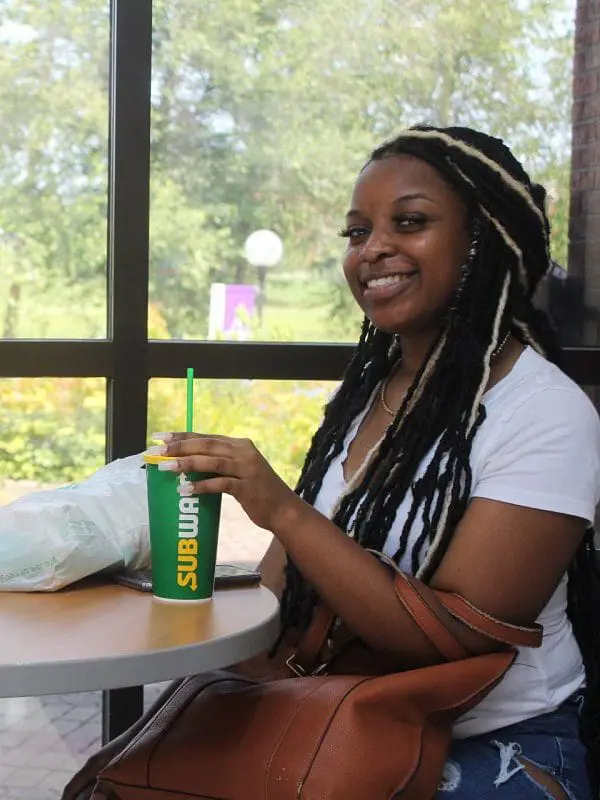 Students smiling and enjoying Subway