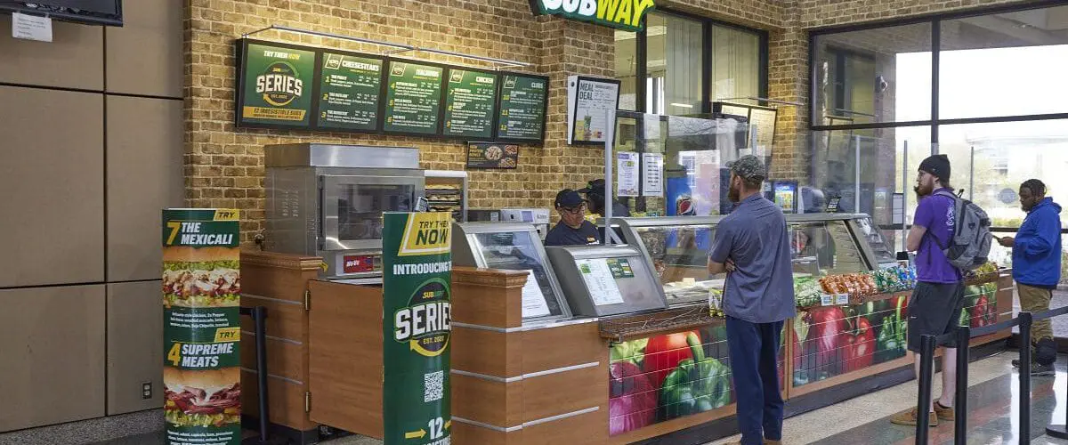 Students in line waiting for subway